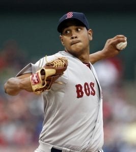 Boston Red Sox starting pitcher Eduardo Rodriguez works against the Texas Rangers during the first inning of a baseball game, Thursday, May 28, 2015, in Arlington, Texas. (AP Photo/Brandon Wade)