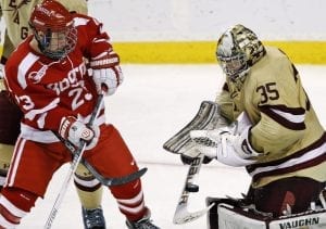 Boston College goalie Parker Milner, right, makes as save as Boston University forward Cason Hohmann looks for the rebound during overtime of the Beanpot tournament championship hockey game in Boston, Monday Feb. 13, 2012. BC won 3-2 in overtime. (AP Photo/Charles Krupa)